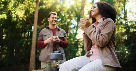 Obraz premium Happy couple, hiking or relax in forest for coffee break, camping adventure or holiday in nature. Weekend travel, morning chat or people in woods for romantic getaway, bonding or breakfast together