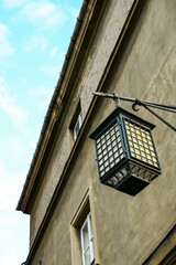 vintage street lamp on the wall of an old house. Beautiful luxury light decor for street lighting