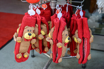 Red knitted mittens with decor are sold in the gift shop