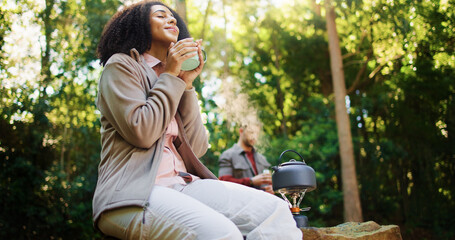 Happy, woman and coffee in woods for trekking adventure, happiness and traveling holiday in nature. Hiking, view scenery and people with hot drink for vacation, reflection and relax in Madagascar