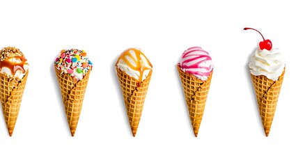 Five delicious ice cream cones with various toppings and flavors arranged in a row on a white background