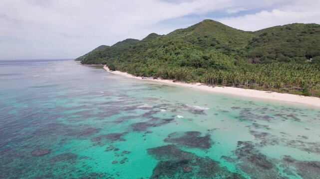 Aerial View of Iloc Island Philippines. Coral Reefs ub Turquoise Water, Sandy Beach and Green Rainforest