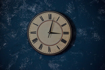 Wall clock on the blue wall