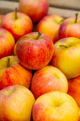 Attractive tasty red apples on the counter of a greengrocer. Ripe apples are ideal for diet and healthy eating
