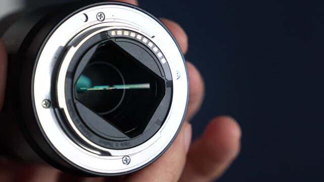Lens mount to camera.
Metallic mechanism for attaching a lens to a camera.
Photography equipment and a modern lens with autofocus