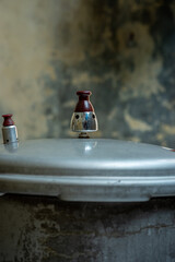 Close-up of a pressure cooker releasing hot steam through its valve, showing the process of cooking with heat and pressure in a kitchen environment