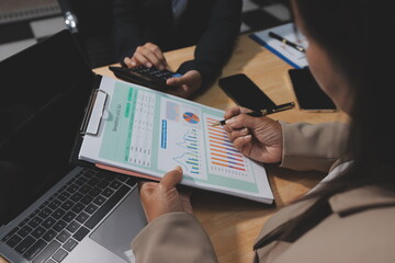 Accounting company provide finance and taxation planning for profitable cash flow, Auditor and accountant team working in office, analyze financial data and accounting record with calculator.Insight