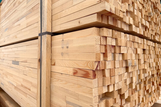 Wooden boards and slabs in the warehouse of the hardware store or in a construction hypermarket. 