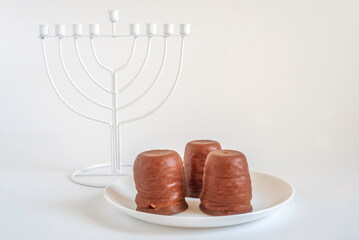 Israeli winter dessert Krembo for Jewish holiday Hanukkah on white background.
