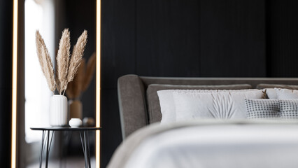 Modern Minimalist Bedroom Interior with Dark Walls and Elegant Lighting