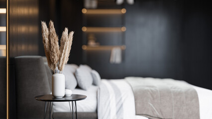 Modern Minimalist Bedroom Interior with Dark Walls and Elegant Lighting