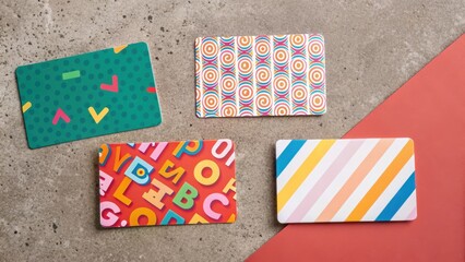 Fototapeta premium bargain hunt Colorful cards with playful designs arranged on a textured surface.