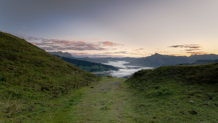Sunrise over Alpine Valley with Fog in Tyrol, Austria