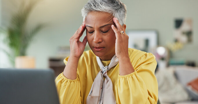 Headache, stress and mature woman in crisis with laptop, debt or financial problem in retirement. Frustrated, pensioner or email at home with unpaid bills, expenses or planning on internet for future