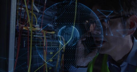 Inspecting tech wearing safety vest checking racks in server room with cables and holographic globe