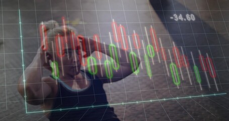 Lying female athlete performing sit-up in sportswear on dark gym floor with financial chart overlay
