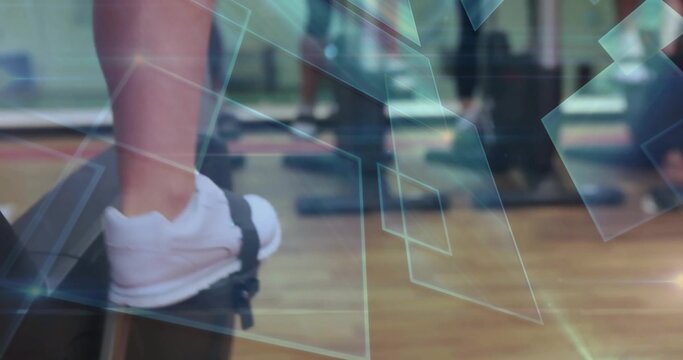 Fototapeta Stepping white athletic sneakered foot onto black aerobic step platform in gym with mirrored walls