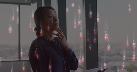 Standing business woman holding tablet and looking out office windows with binary code, copy space