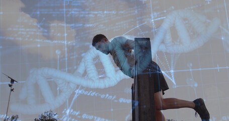 Leaning on wooden beam, man doing dip exercise outdoors, with tripod stand and DNA graphic overlay