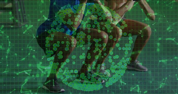 Fototapeta Squatting partners wearing lace-up running shoes at fitness studio, with green data overlay