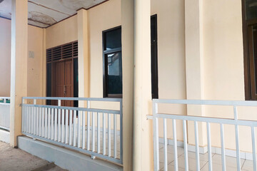 White Classroom Building with two floors showing the walls