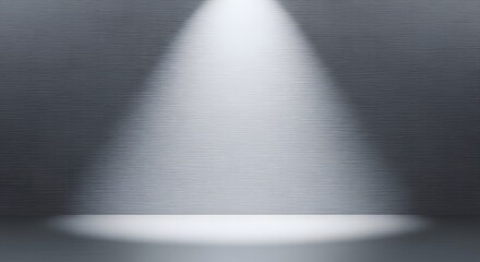 Obraz premium Dramatic spotlight illuminating a dark, empty studio background for showcasing a product, performance or concept
