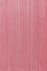 texture of valuable wood. wooden pink board. lumber. koto, African, Pterygota, view from above. vertical texture