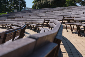 Curved seating rows in an amphitheater, designed for audience comfort.
