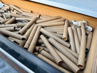 Stack of empty cardboard tubes ready for recycling or reuse in eco friendly packaging