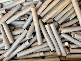 Stack of empty cardboard tubes ready for recycling or reuse in eco friendly packaging