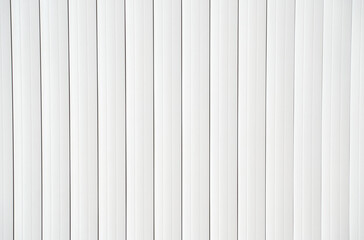 Obraz premium White vertical lines pattern symmetrical minimalist background with clean modern design.