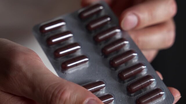 A man holds antidepressants prescribed by his doctor.
Medicines and health-improving medications.
Medicine capsules.
Vtamins in blitzer packaging.
