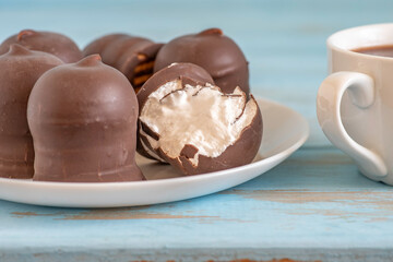 German treats Chocolate Kisses on white and blue background.