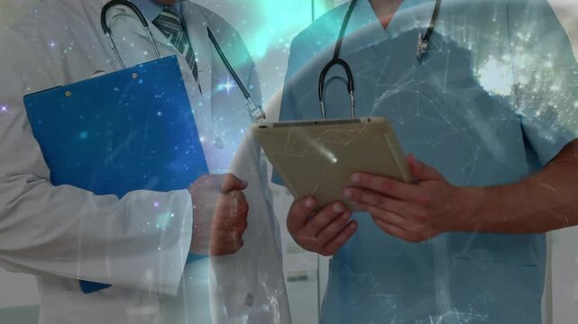 Two doctors conferring over tablet, folder in corridor, cosmic overlay intensifying across torsos