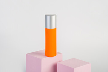 Skin care or sunscreen cosmetic with stylish props on white background.