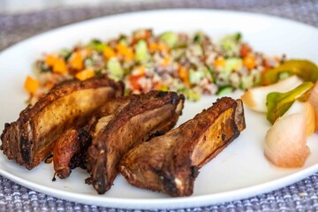 healthy superfood well balanced in nutrients, roasted pork chops, quinoa, salad, vegetables