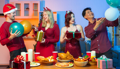 Fototapeta premium Dinner and group of people celebrating together at Merry Christmas & Happy New Year.