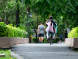 Fototapeta premium Blurred Runner, Jogger in Public Park, Active Lifestyle Background