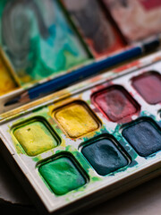 Colorful Watercolor Paint Palette Close-up - Artist Gouache Colors and Creative Art Supplies in Action.