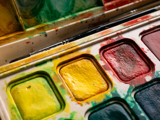 Colorful Watercolor Paint Palette Close-up - Artist Gouache Colors and Creative Art Supplies in Action.