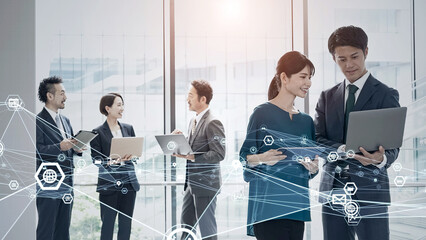 会議するビジネスパーソンのグループと通信ネットワーク © metamorworks