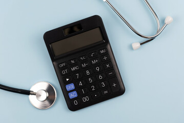 Top view of calculator and stethoscope