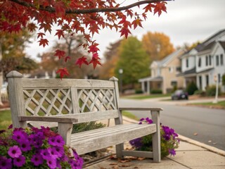 Autumn bench with vibrant flowers and suburban street scene