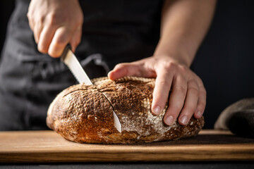 Cutting artisan sourdough bread