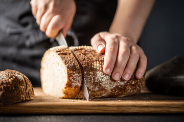 Slicing fresh sourdough bread