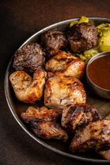 Assorted grilled meats with sauce