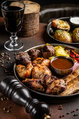 Mexican grilled meat platter with wine