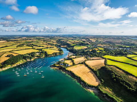 Farms and Fields over St Mawes from drone, Carrick Roads, River Fal, Falmouth, Cornwall, UK
