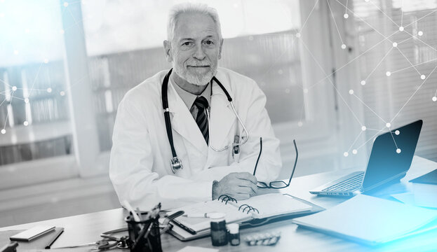Portrait of male senior doctor; light effect