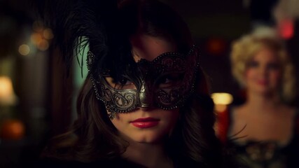 Woman wearing venetian mask at masquerade ball. Media - Powered by Adobe